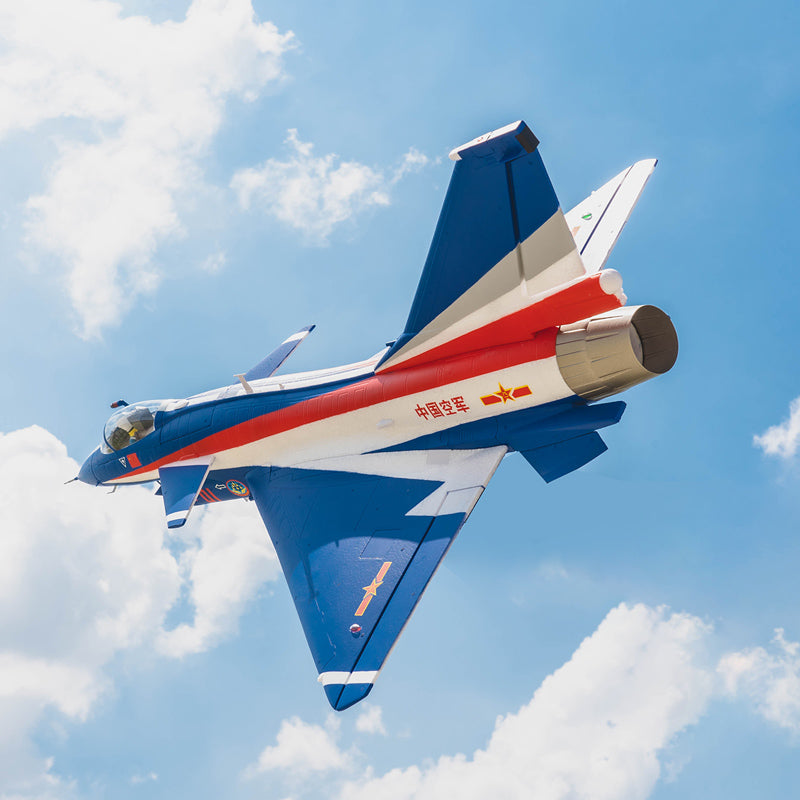 J-10 EDF jet in flight with vibrant red and blue design against a blue sky