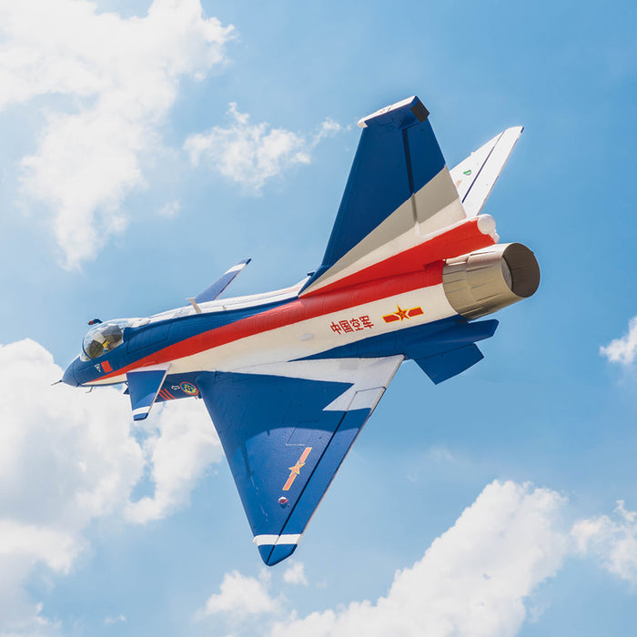 J-10 EDF jet in flight with vibrant red and blue design against a blue sky