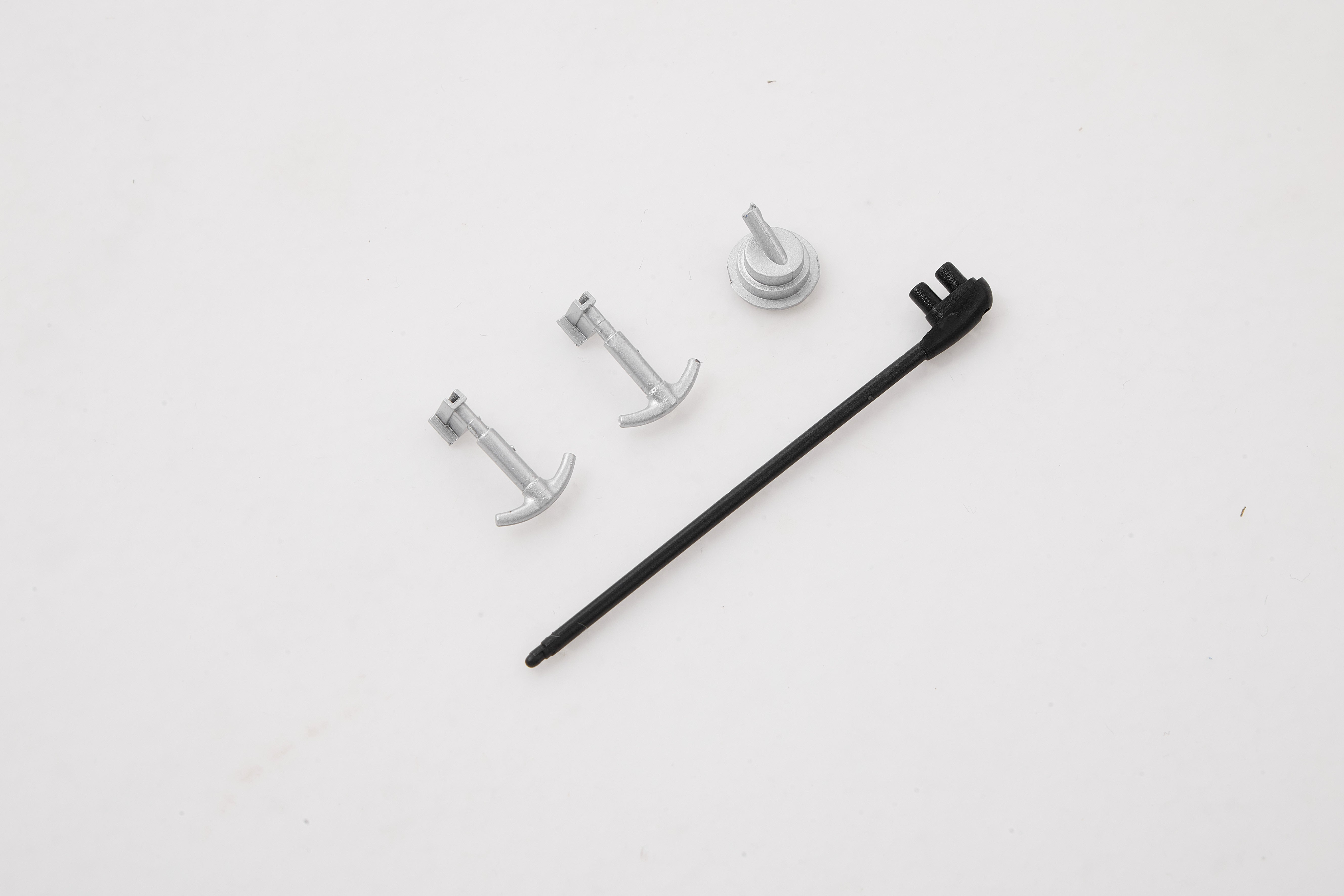 RC model accessories including gray pins and a black rod for customization.