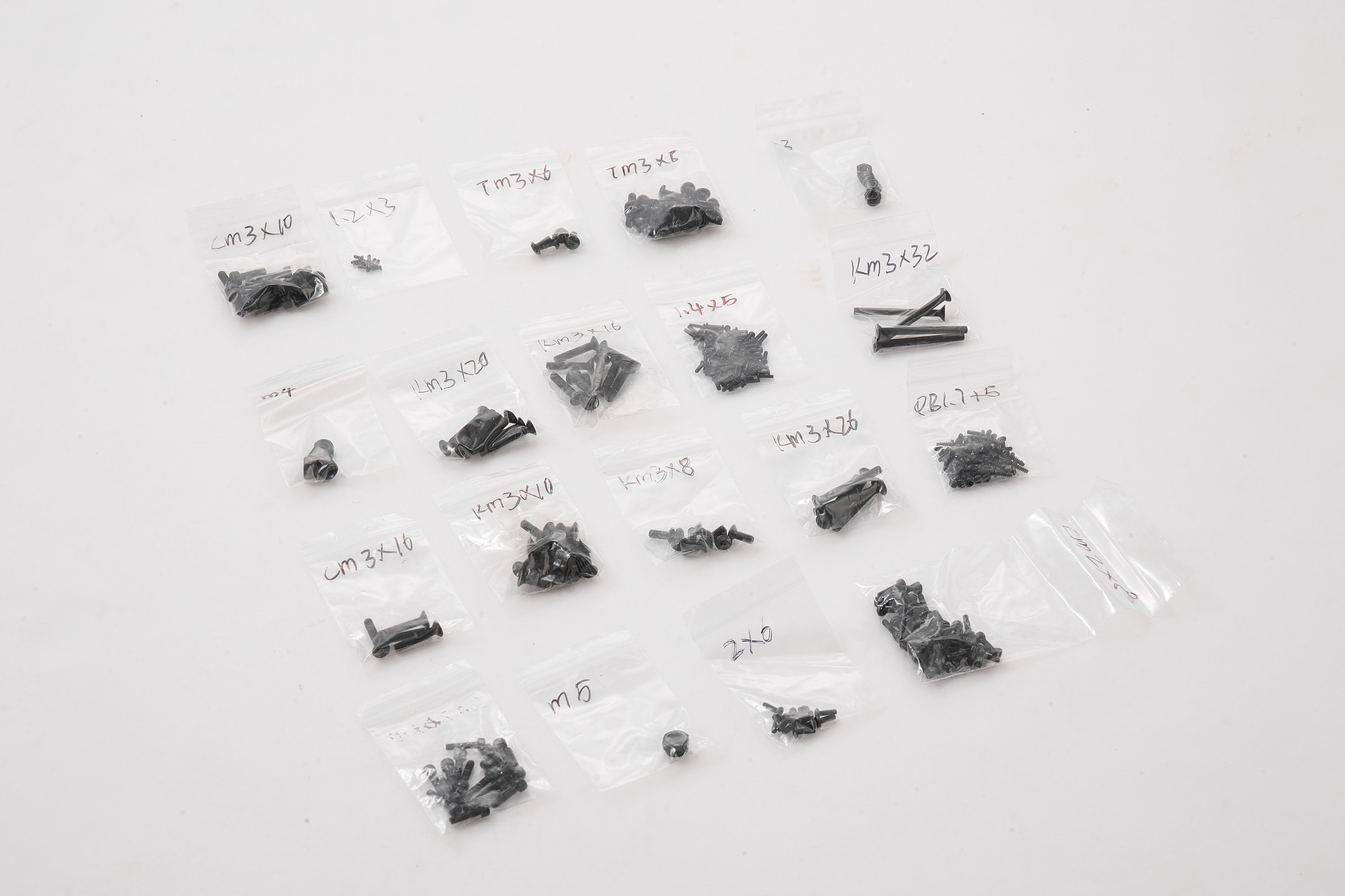 RC model screw set parts in labeled bags for 1:10 Toyota FJ40 assembly.