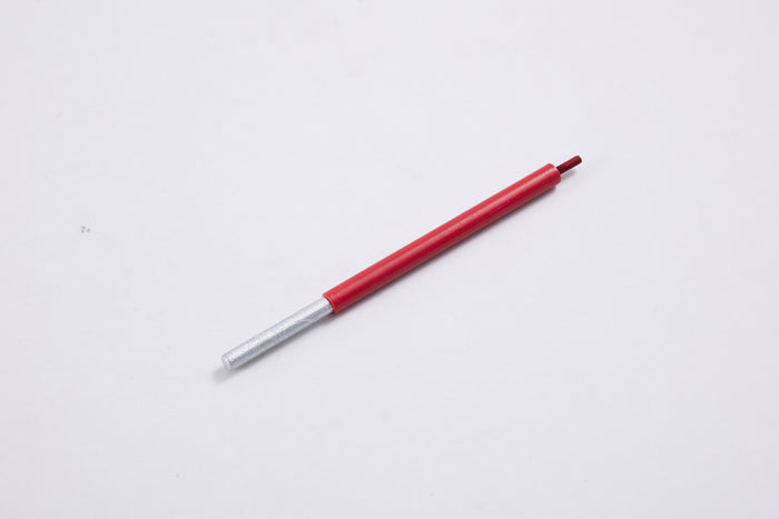 Red pen with silver tip on a plain white background