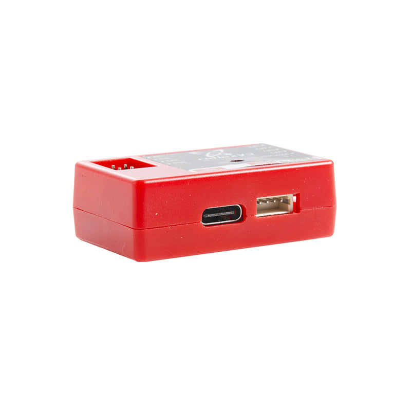 Compact FMS Reflex V3 flight controller with USB-C and data port in vibrant red