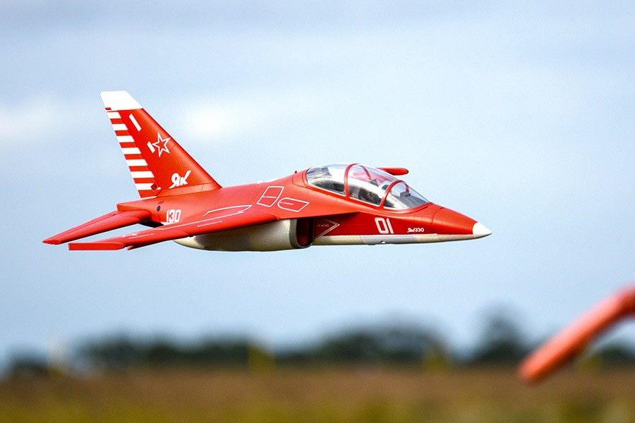 FMS Yak-130 V2 red EDF jet in flight showcasing sleek design and details