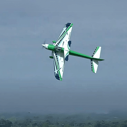 FMS F3A Explorer PNP doing aerial tricks with green and blue design.