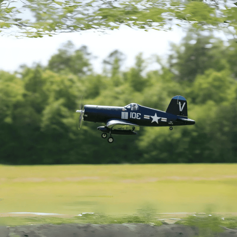 FMS 800mm F4U Corsair flying in navy blue with star markings.