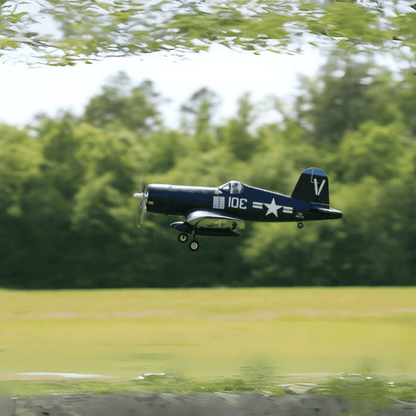 FMS 800mm F4U Corsair flying in navy blue with star markings.