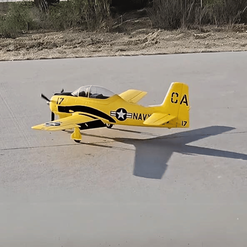 FMS T-28D V4 yellow RC airplane on the runway